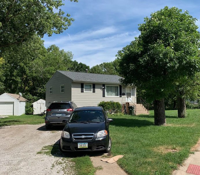 Old shingles curling up on roof in Iowa City