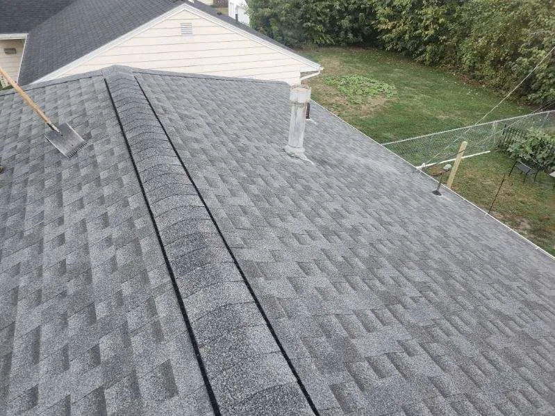 Completed residential roof replacement in Cedar Rapids, IA with Owens Corning TruDef Duration shingles in Williamsburg Grey.