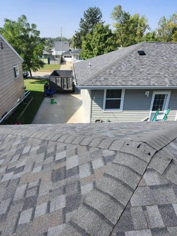 Close-up view of Owens Corning TruDef Duration shingles in Williamsburg Grey on a residential roof in Cedar Rapids, IA.