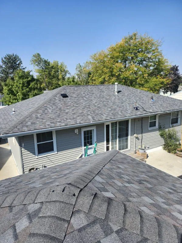 Close-up view of Owens Corning TruDef Duration shingles in Williamsburg Grey on a residential roof in Cedar Rapids, IA.