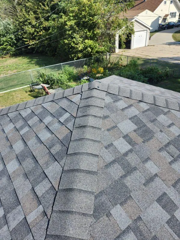 Close-up view of Owens Corning TruDef Duration shingles in Williamsburg Grey on a residential roof in Cedar Rapids, IA.