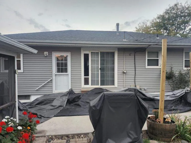 Rear exterior view of a residential home in Cedar Rapids, IA after completing a full roof replacement.