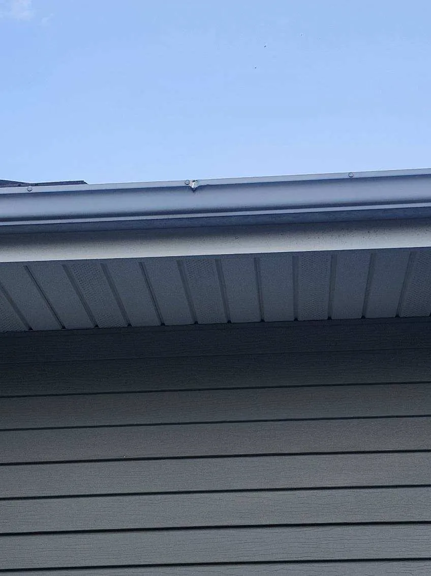 Close-up of roof edge, gutter, and soffit detail on a residential home in Cedar Rapids, IA after roof replacement.